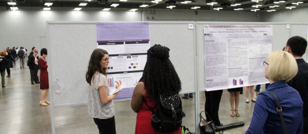 Mihaela explaining her poster