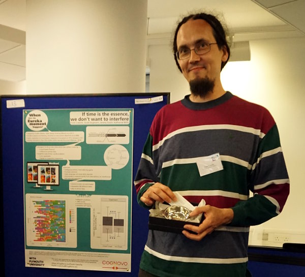 Frank Loesche showing his prize for best poster